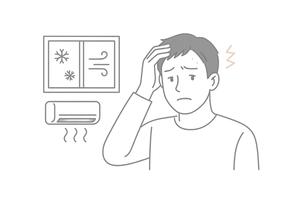 冬の乾燥した空気と暖房で頭皮のかゆみやフケに悩む男性のイメージ